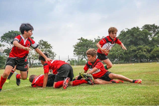 Cavatoni coaches for Valley Fort Rugby Club where these young players are practicing.